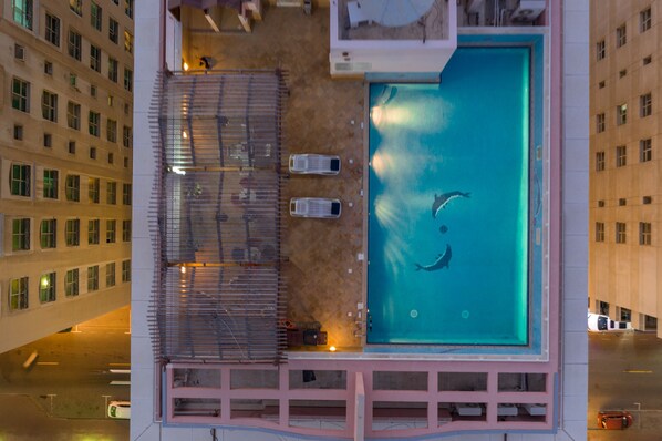 Outdoor pool, open 9:00 AM to 9:00 PM, pool umbrellas, sun loungers