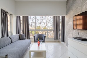 Apartment, 1 Bedroom (Ha-Yarkon St 210 Flat 5) | Living area | 43-inch flat-screen TV with satellite channels, TV - Sea Suites Apartments (Tel Aviv)