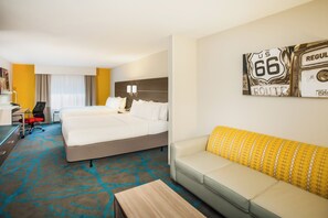 A hotel room with a double bed, a sofa, a desk, and a chair. - Holiday Inn Express & Suites Litchfield West by IHG (Litchfield)