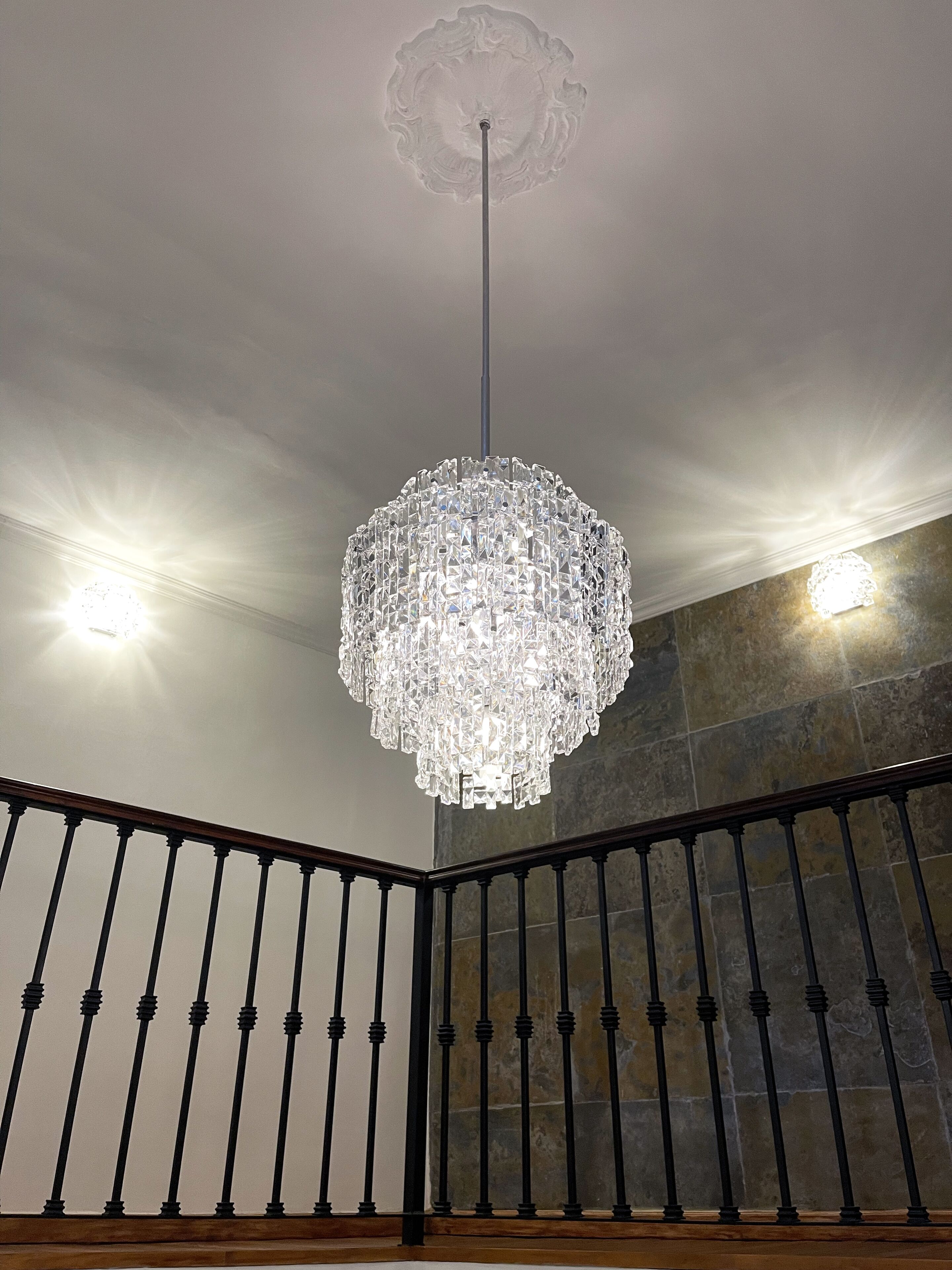 A chandelier with a crystal design hanging from the ceiling.