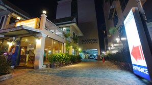 A hotel entrance with a sign reading "Diamond City Place" and an "Entrance" sign. - Diamond City Place (Pattaya)