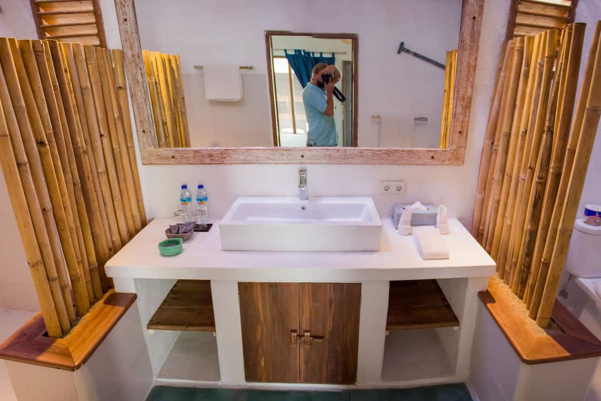 deluxe room | bathroom | shower, designer toiletries, hair dryer, towels