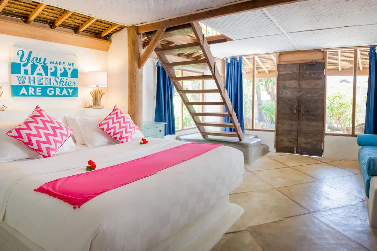 Phòng Suite có thiết kế đặc trưng, 1 phòng ngủ, quang cảnh vườn, cạnh hồ bơi | Phòng khách