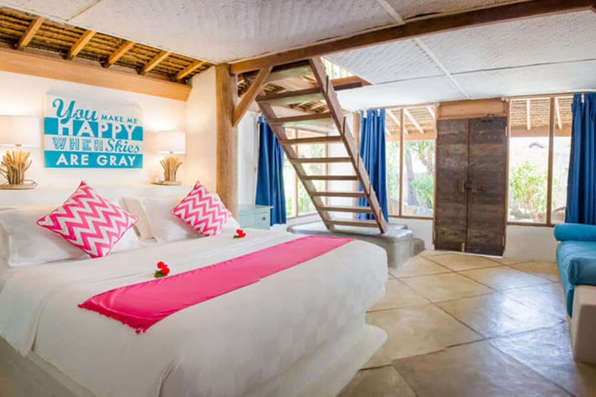 signature suite, 1 bedroom, garden view, poolside | 1 bedroom, in-room safe, desk, laptop workspace