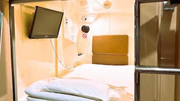 Male Standard Capsule Lower Bunk, Check out must by 10AM each day, Tattoos not allowed, Non Smoking