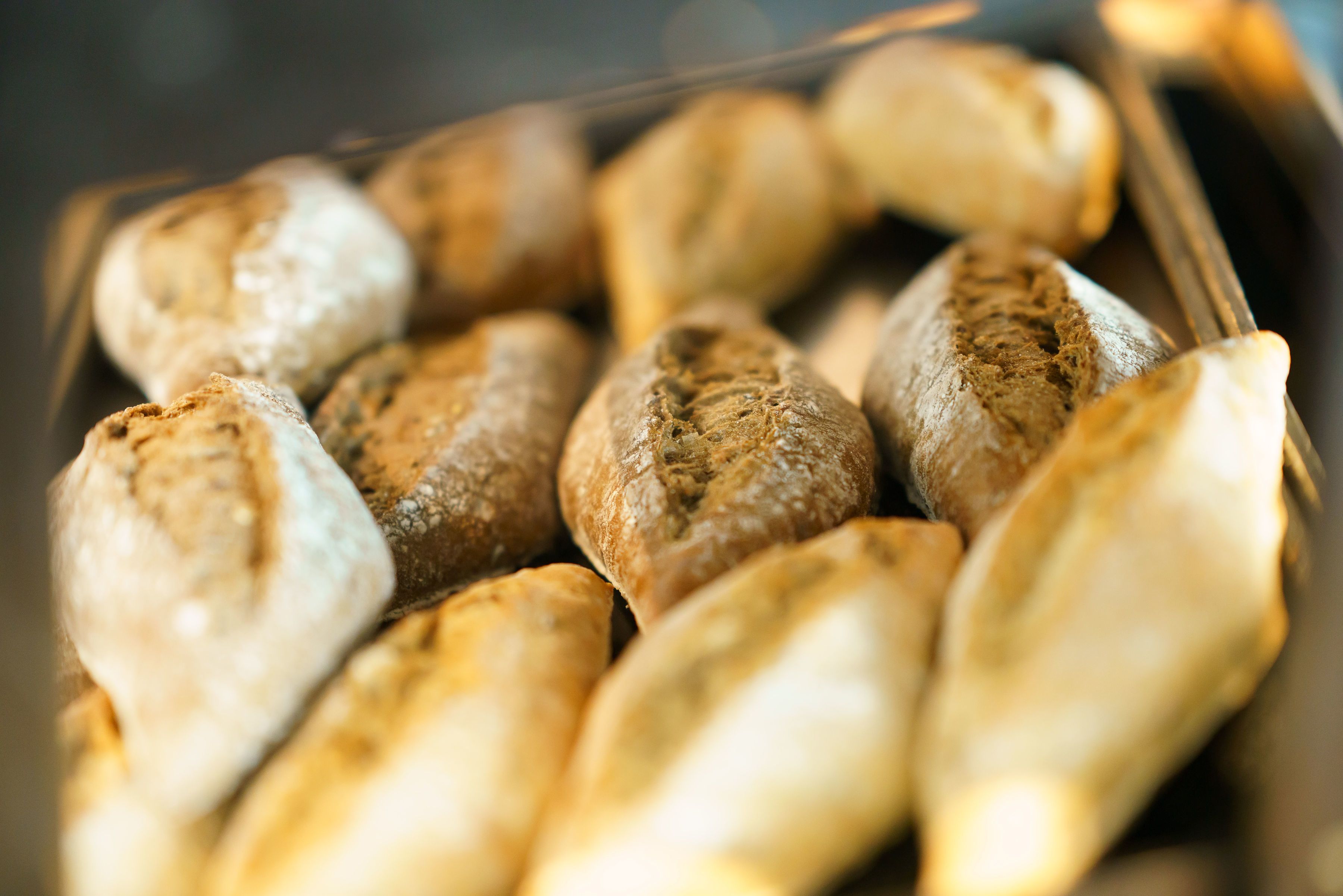 A tray of freshly baked bread rolls.