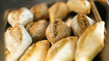A tray of freshly baked bread rolls.
