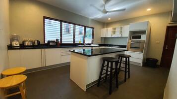 Villa, 5 Bedrooms | Private kitchen | Full-size fridge, microwave, stovetop, coffee/tea maker