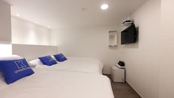 Economy Triple Room, 1 Bedroom | Blackout drapes, iron/ironing board, free WiFi, bed sheets
