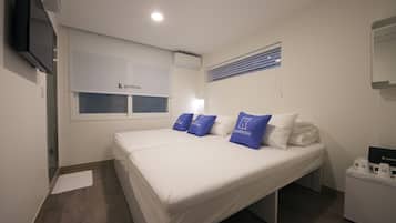 Standard Triple Room, 1 Bedroom | Blackout drapes, iron/ironing board, free WiFi, bed sheets