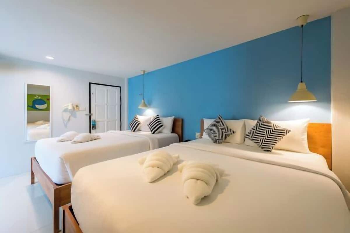Premium bedding, desk, laptop workspace, blackout drapes
