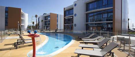 Seasonal outdoor pool, open 9:00 AM to 9:00 PM, sun loungers