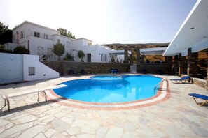 Seasonal outdoor pool, pool umbrellas, pool loungers