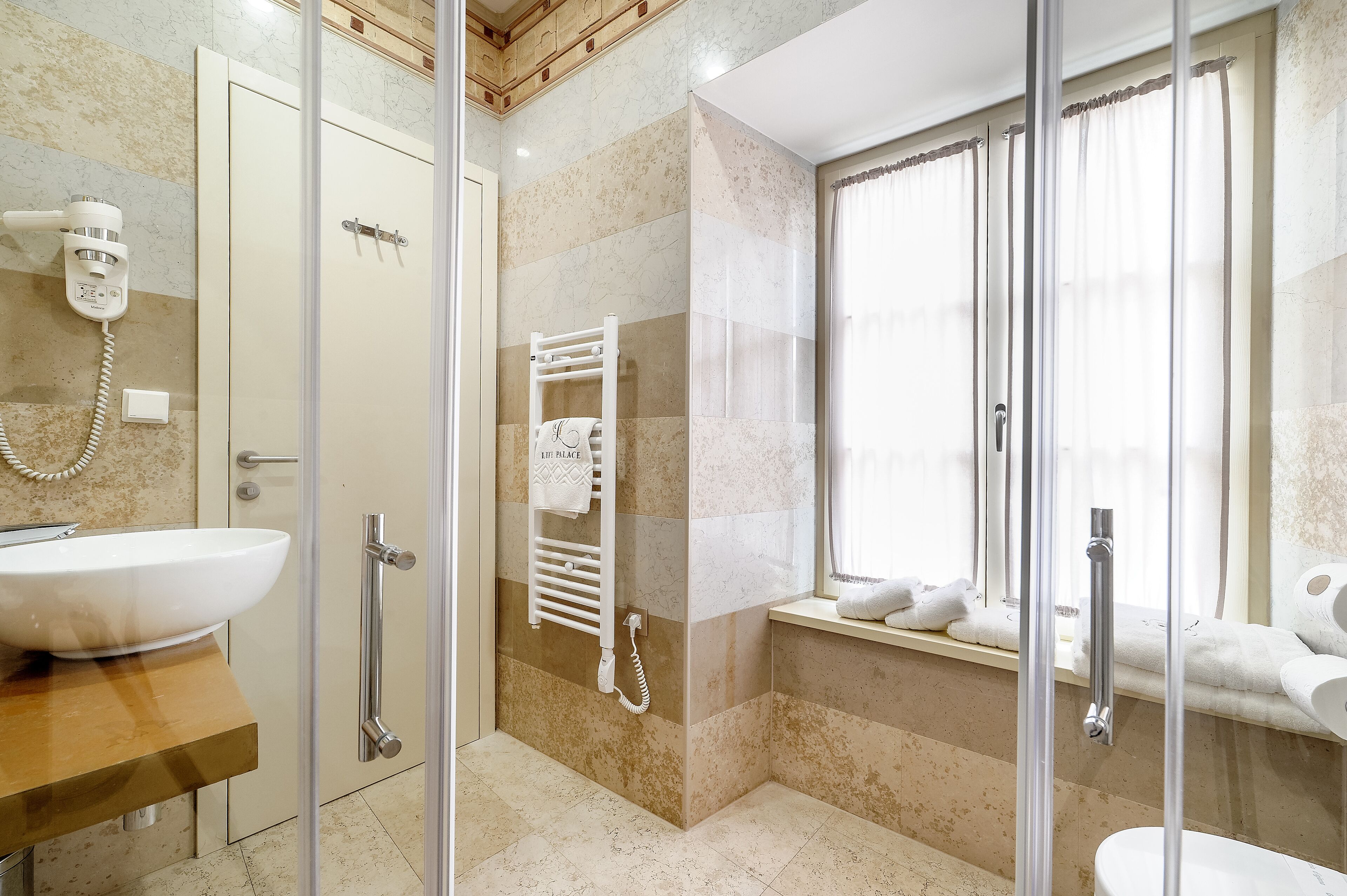 superior double room | bathroom | free toiletries, hair dryer, bathrobes, slippers