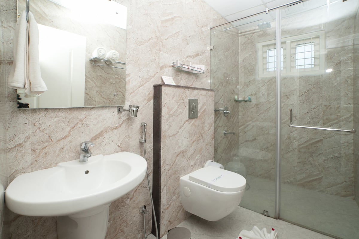 shower, rainfall showerhead, designer toiletries, hair dryer