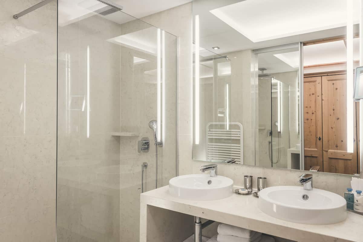 designer toiletries, hair dryer, bathrobes, slippers