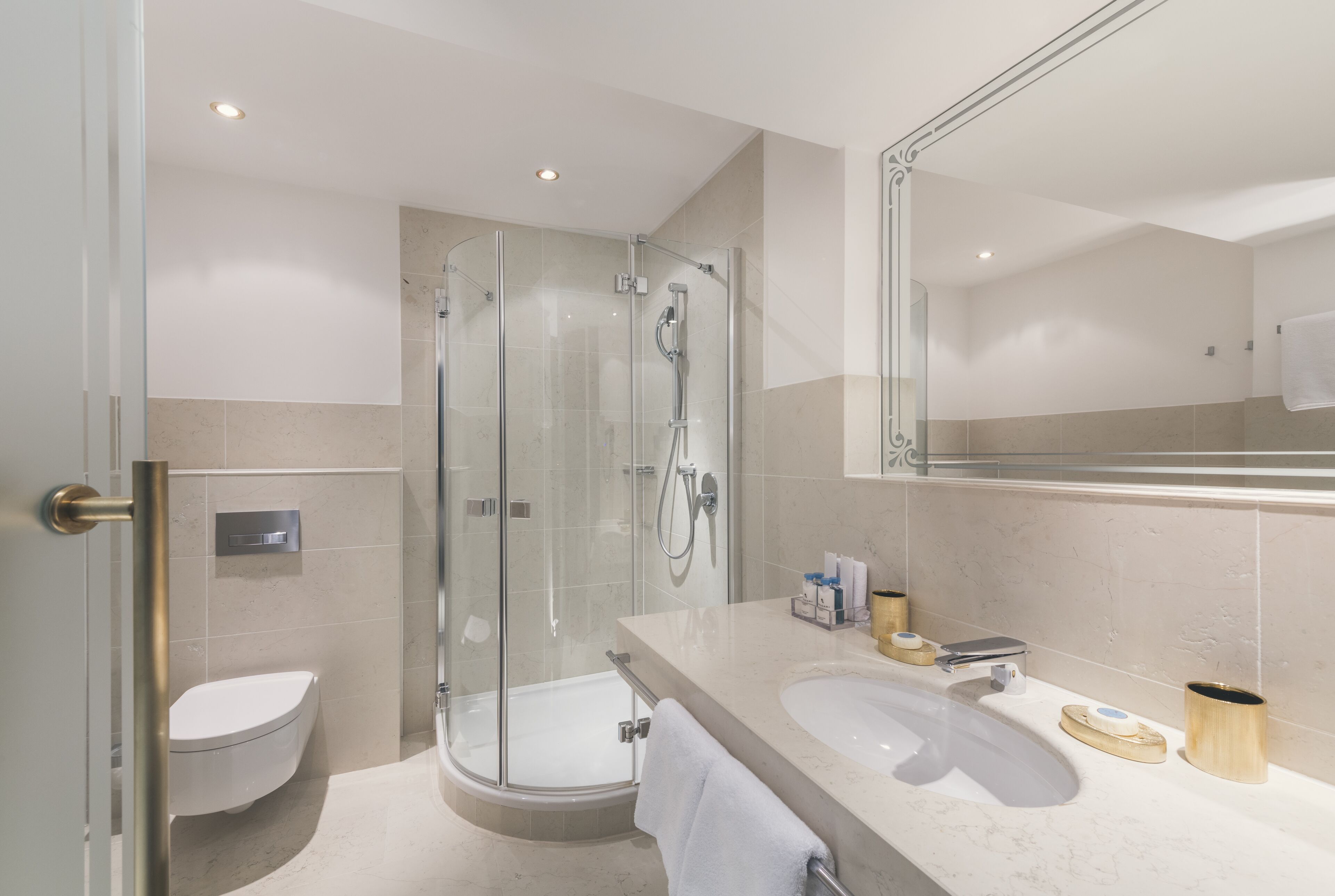 designer toiletries, hair dryer, bathrobes, slippers