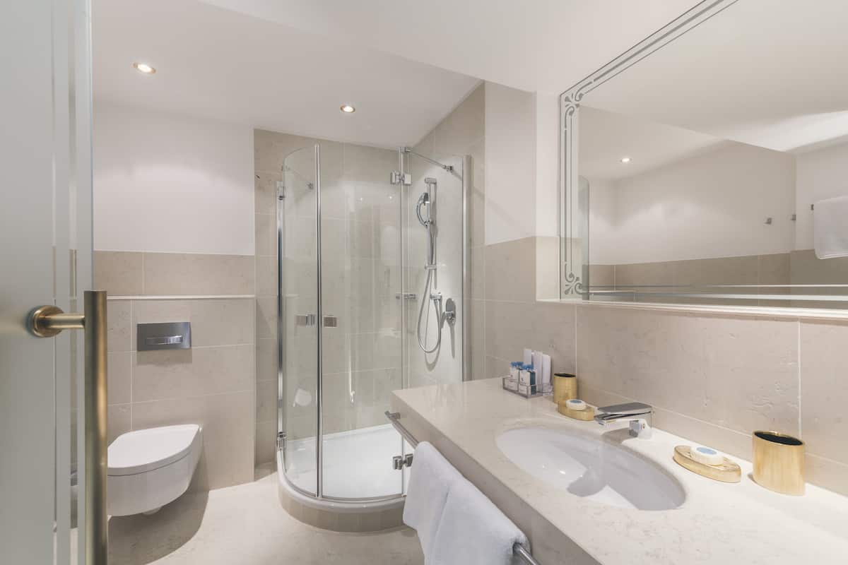 designer toiletries, hair dryer, bathrobes, slippers