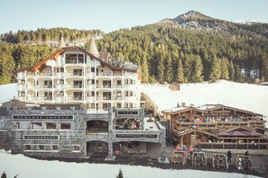 A multi-story hotel with a spa, restaurant, and ski-related amenities.