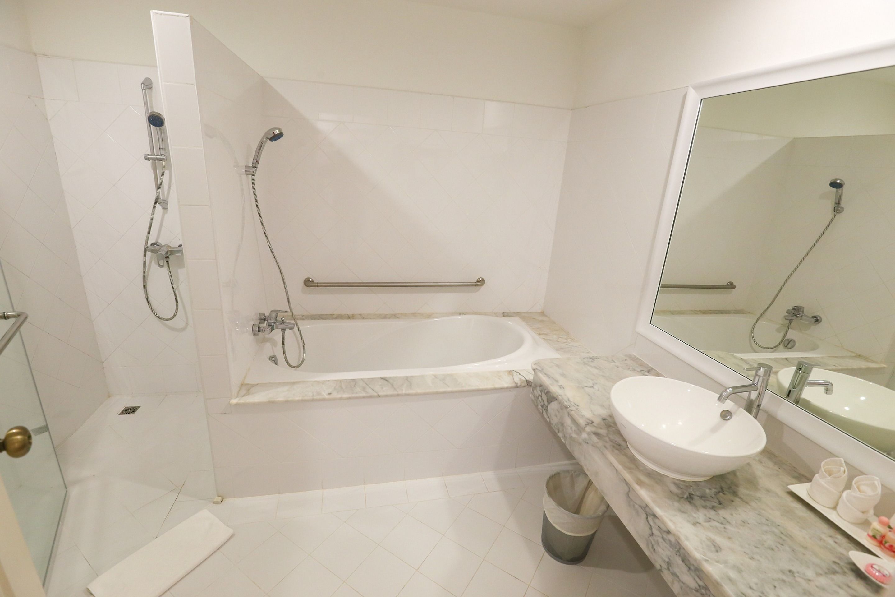 combined shower/bathtub, designer toiletries, hair dryer, bathrobes