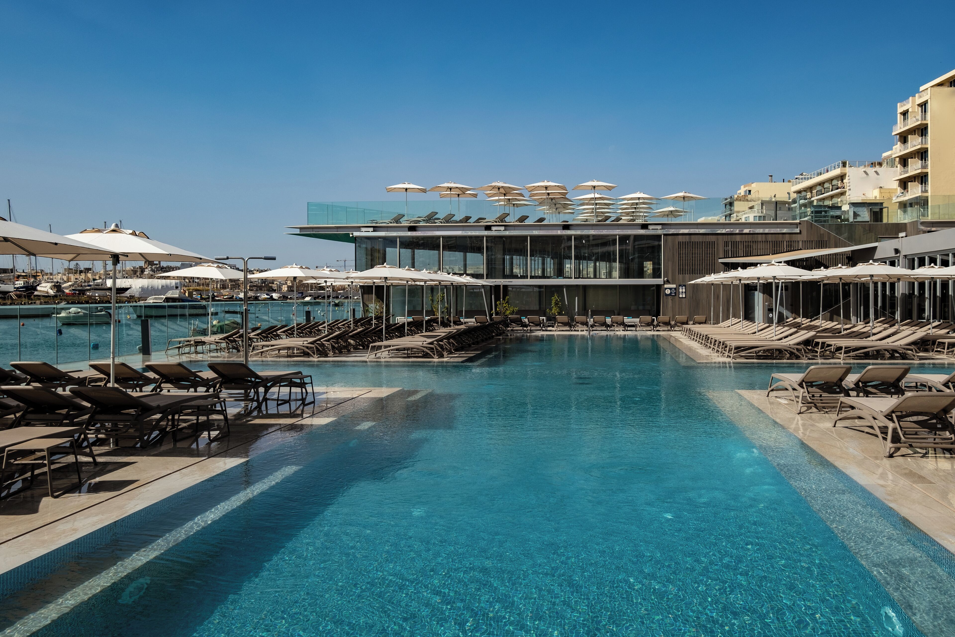 Seasonal outdoor pool, pool umbrellas, pool loungers