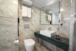 Shower, free toiletries, hair dryer, slippers