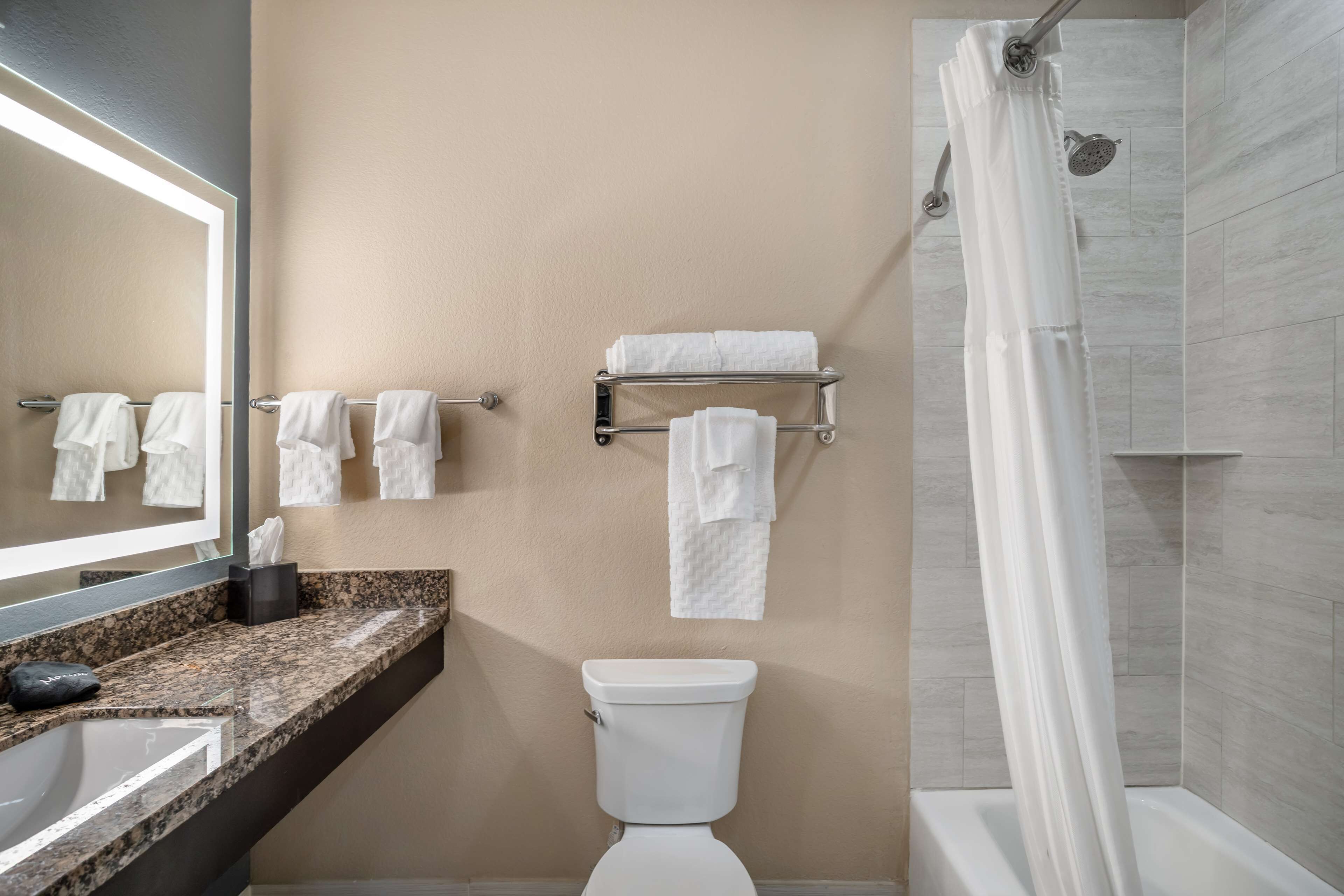 suite, 1 king bed, non smoking, refrigerator & microwave | bathroom | combined shower/bathtub, free toiletries, hair dryer, towels