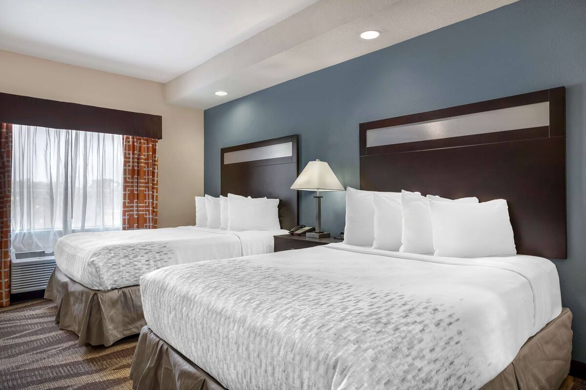 suite, 2 queen beds, non smoking, refrigerator & microwave | desk, laptop workspace, iron/ironing board, free cots/infant beds