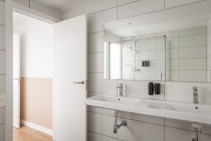 Family Room | Bathroom | Shower, hair dryer, towels, soap - BYPILLOW House (Barcelona)