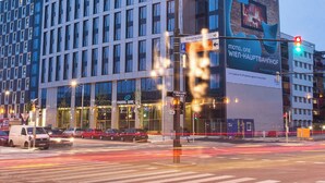 A modern hotel with a unique architectural design, featuring a prominent rooftop section and large windows. - Motel One Wien-Hauptbahnhof (Vienna)