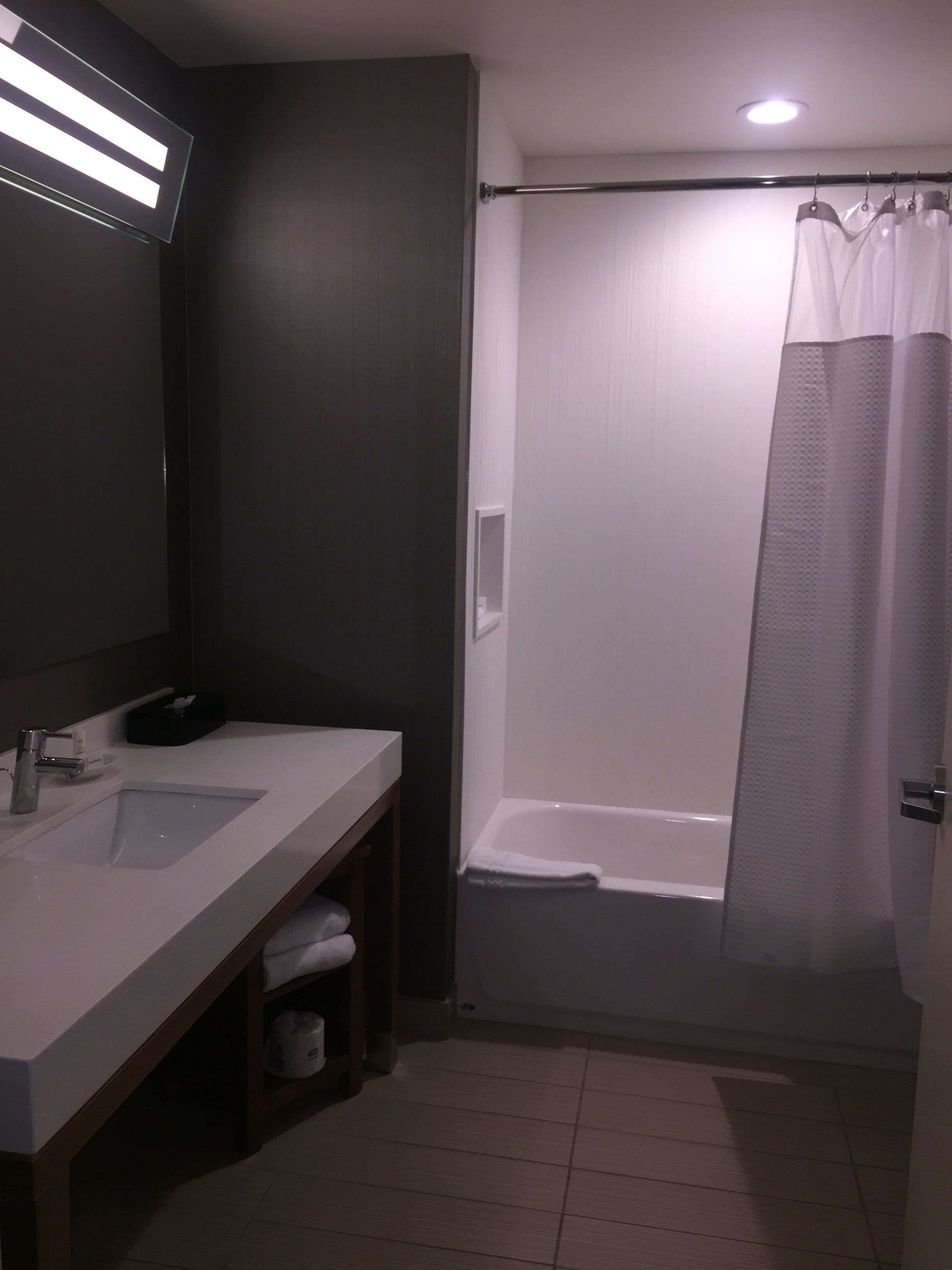 designer toiletries, hair dryer, towels, soap