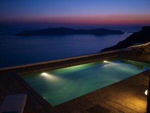 Outdoor pool, open 9 AM to 9 PM, pool umbrellas, sun loungers