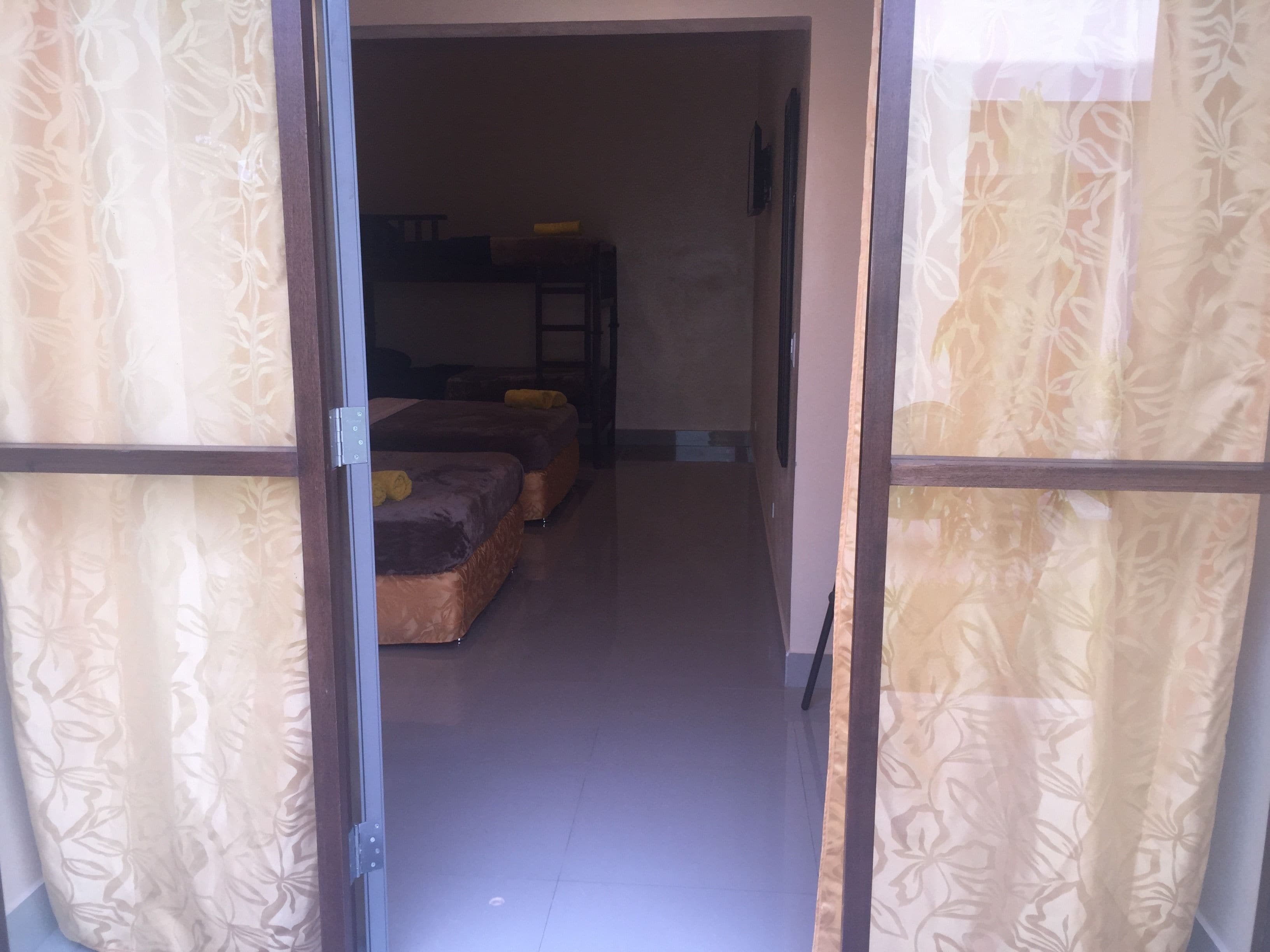 family studio suite, 1 bedroom, private bathroom | desk, free wifi, bed sheets