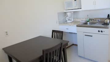 Family Room, 2 Bedrooms, Garden View, Garden Area | Private kitchenette | Fridge, microwave, coffee/tea maker