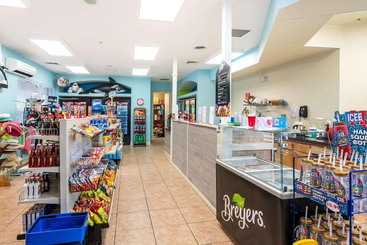 A Breyers ice cream shop with a variety of ice cream products and a cash register.