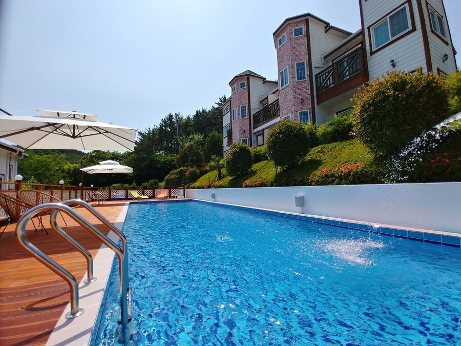 Seasonal outdoor pool, open 1:00 PM to 8:00 PM, pool umbrellas
