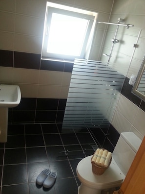 Studio, Ocean View | Bathroom | Shower, hair dryer, slippers, towels