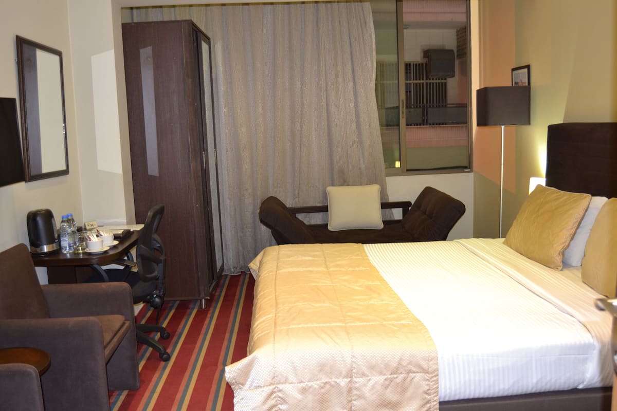 Deluxe Room | Biancheria da letto di alta qualità, minibar, una cassaforte in camera