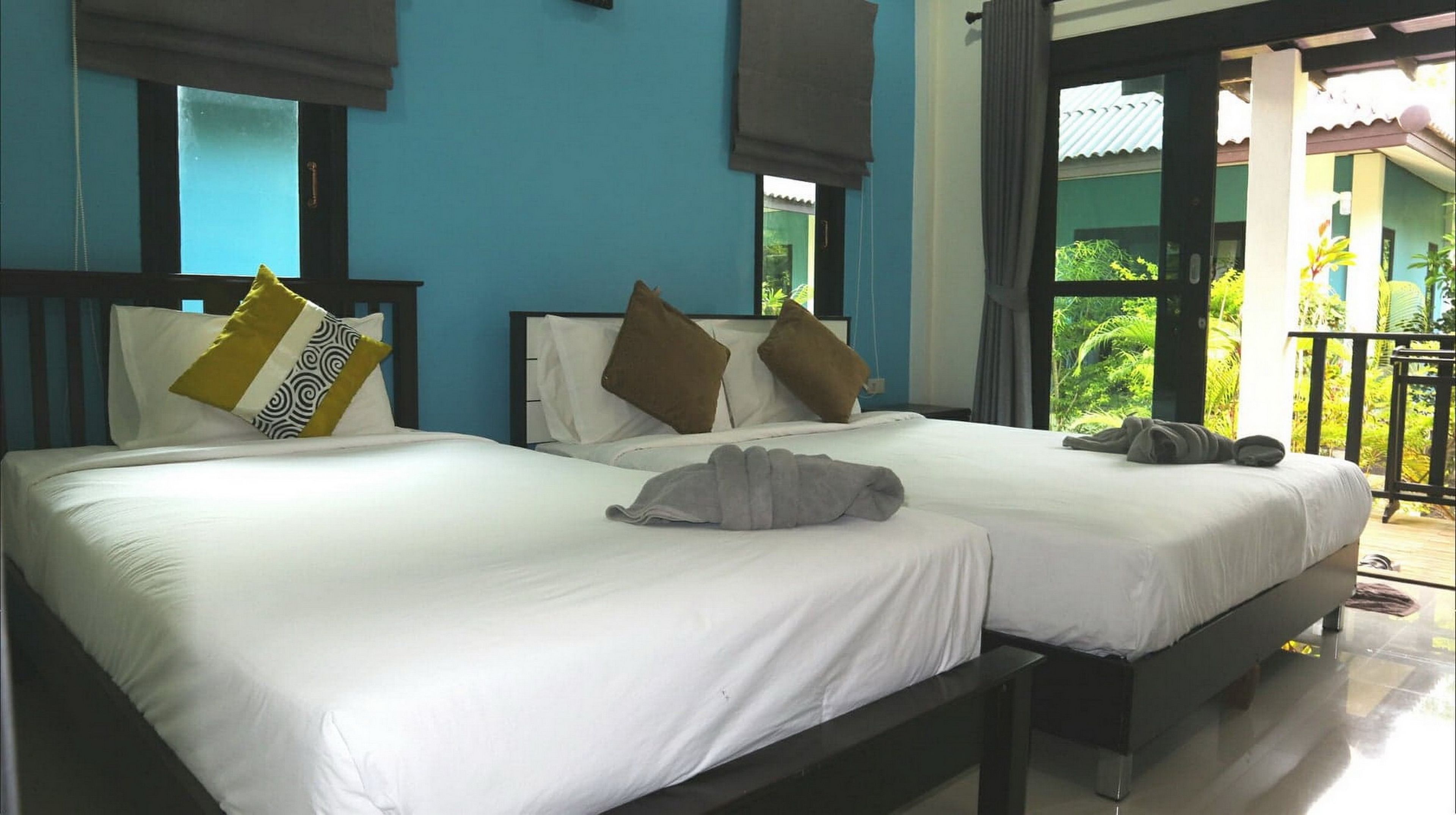 deluxe triple room, 1 bedroom, non smoking, patio | minibar, in-room safe, blackout curtains, free wifi