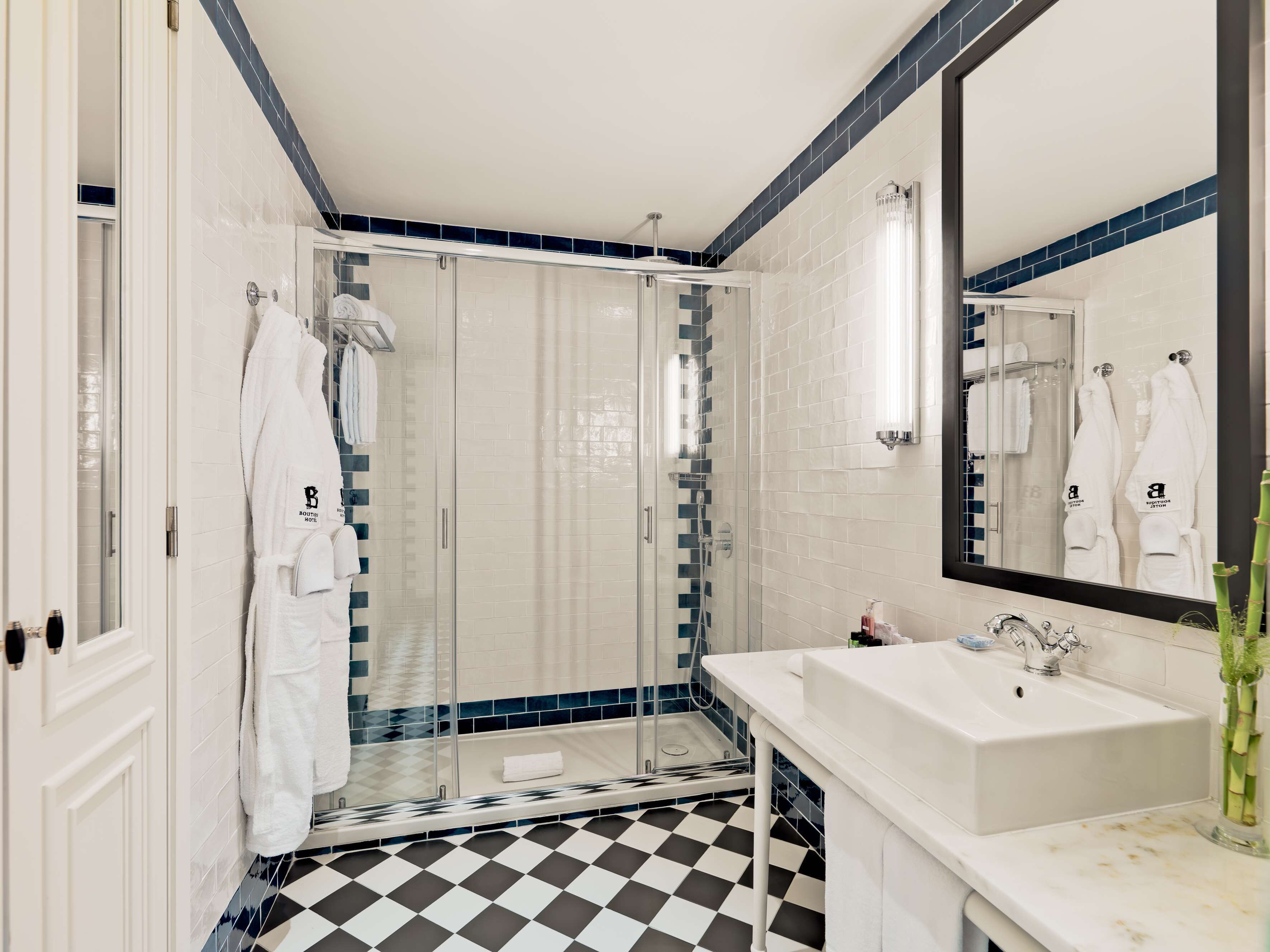 rainfall showerhead, eco-friendly toiletries, bathrobes, slippers