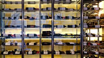 A wine cellar with multiple shelves of wine bottles.