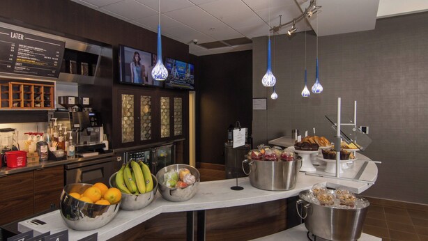 A buffet area with a variety of fruits, vegetables, and baked goods. - Courtyard Raleigh-Durham Airport/Brier Creek (Raleigh)