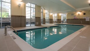 An indoor swimming pool with clear water, a lifeguard chair, and a sign indicating no diving. - Courtyard Raleigh-Durham Airport/Brier Creek (Raleigh)