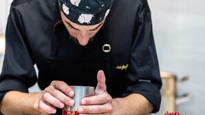 A person preparing a drink with a metal cup on a wooden board. - Hotel Astro Mediceo (Florence)