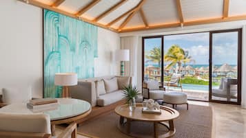 Casita, Suite, 1 cama King size, para no fumadores, frente al mar | Área de sala de estar | Televisión LED y películas con cargo