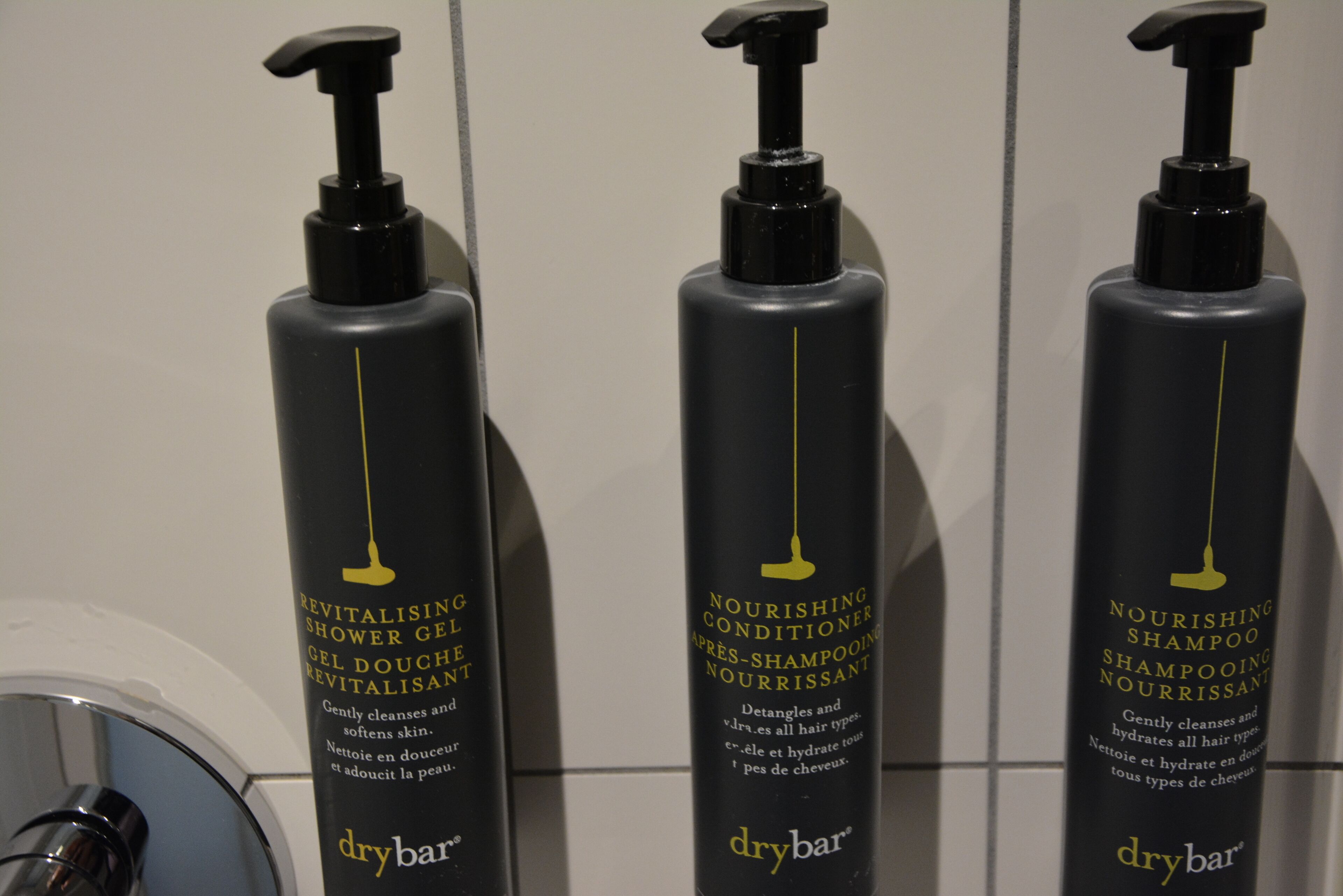 shower, designer toiletries, hair dryer, towels