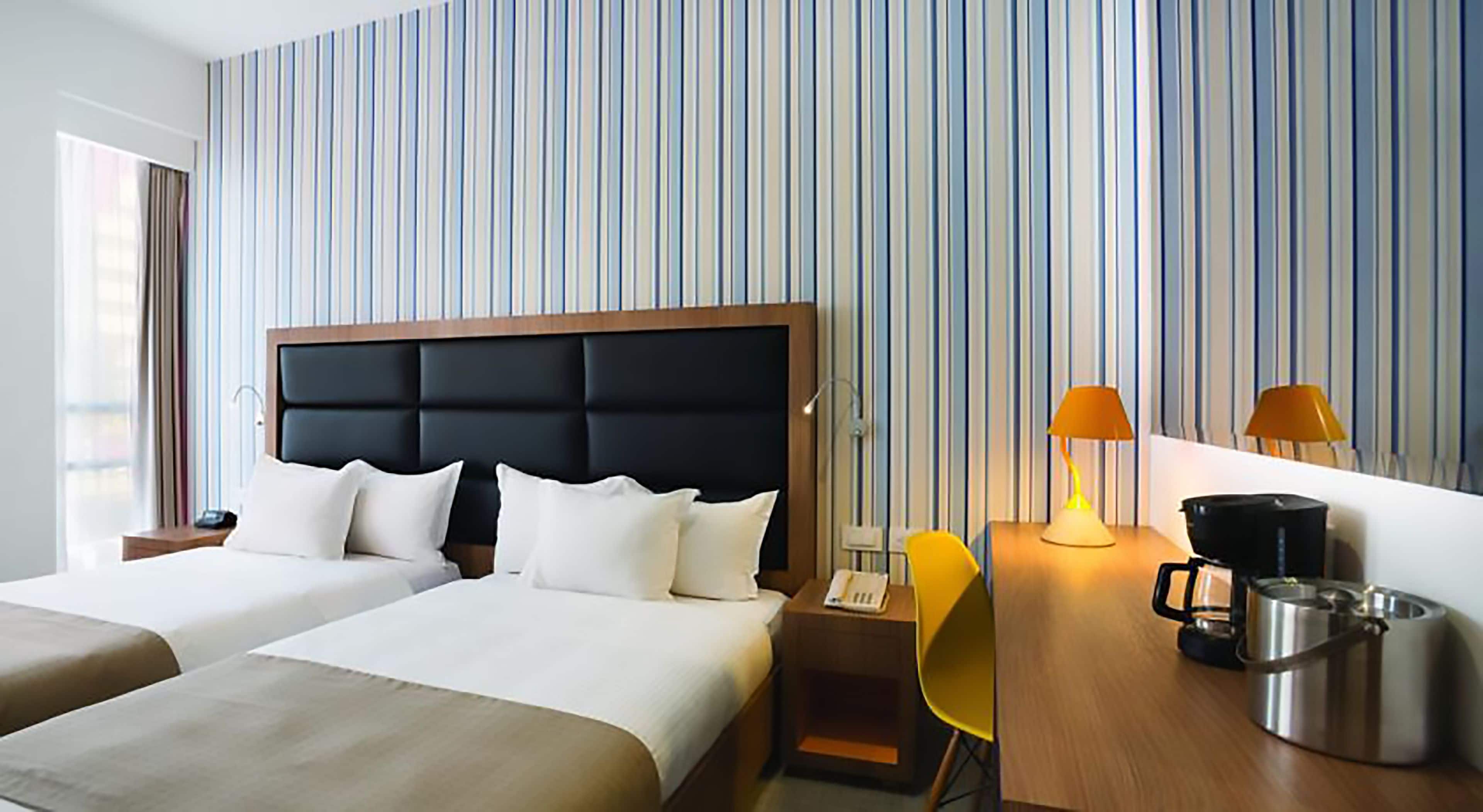 twin room | minibar, in-room safe, desk, blackout curtains