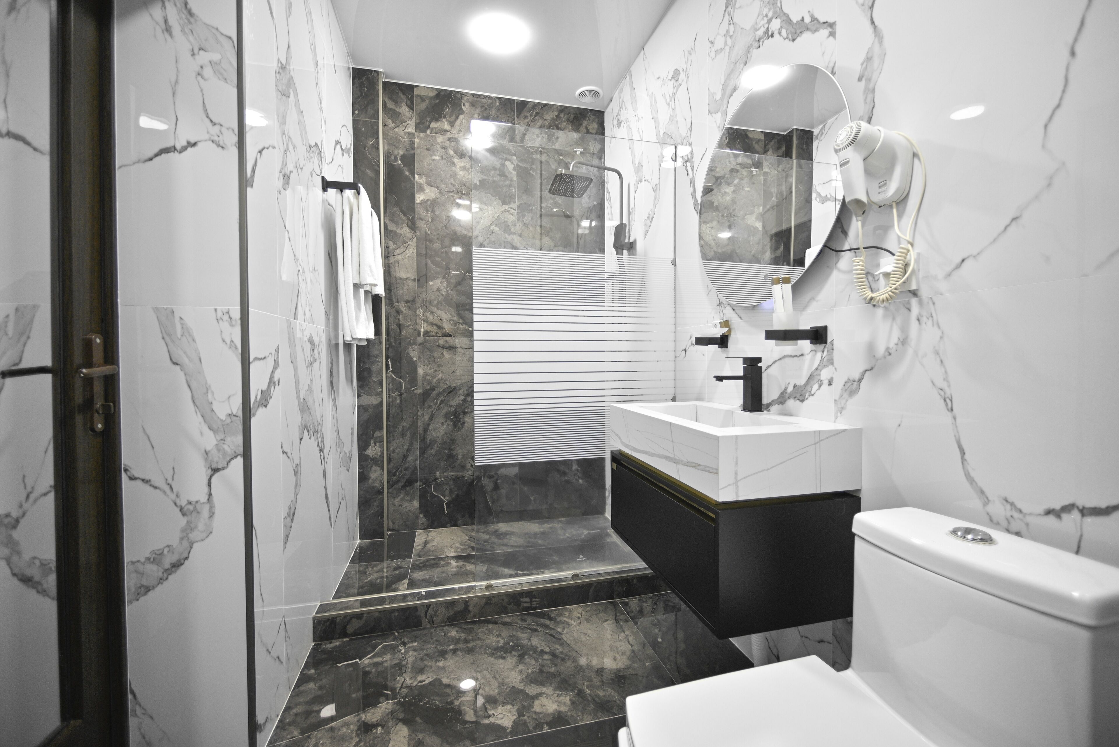 Shower, rainfall showerhead, designer toiletries, hair dryer