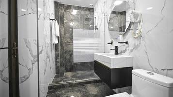 Shower, rainfall showerhead, designer toiletries, hair dryer