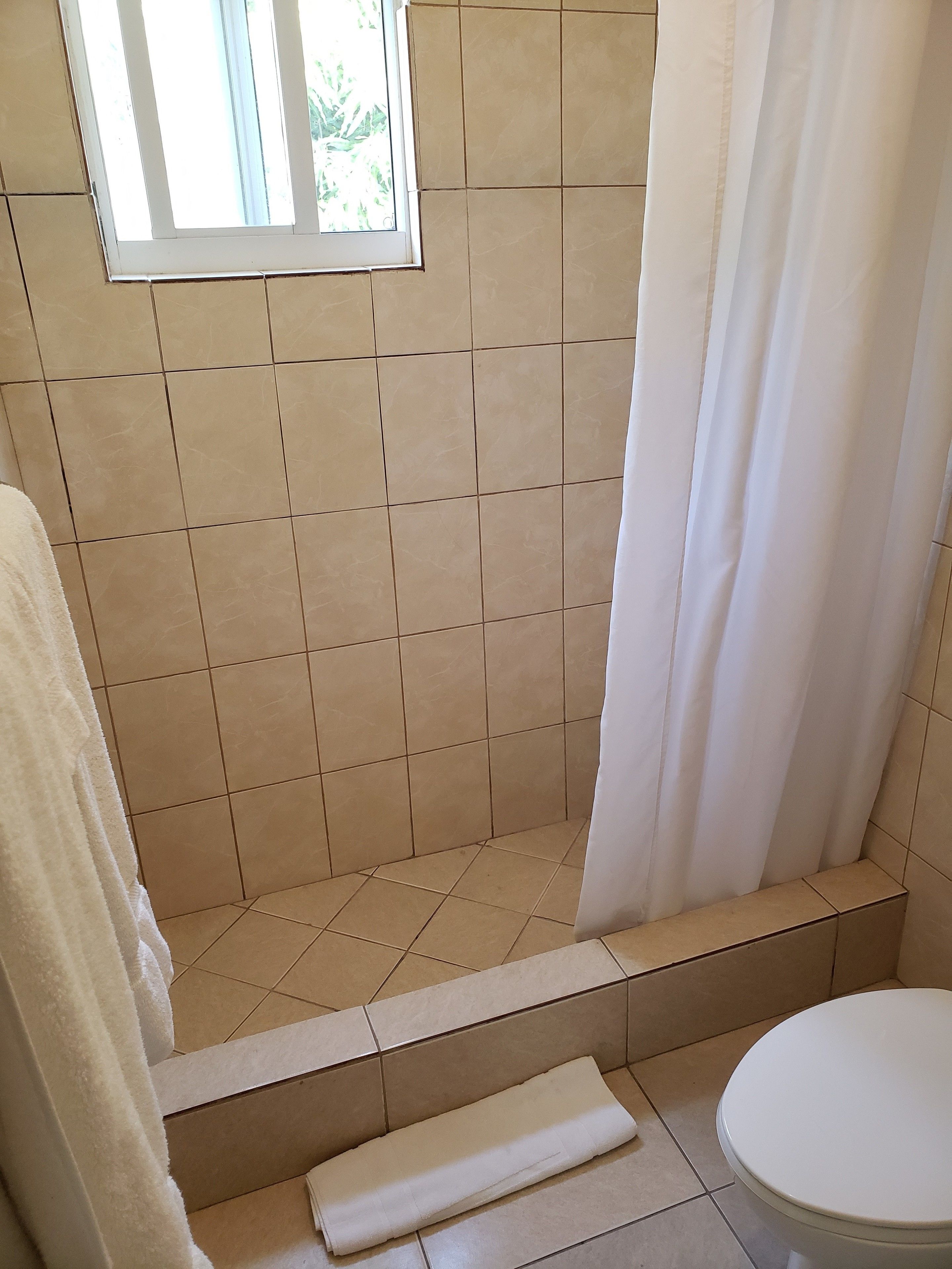 Family Studio, 2 Double Beds | Bathroom | Shower, hair dryer, towels